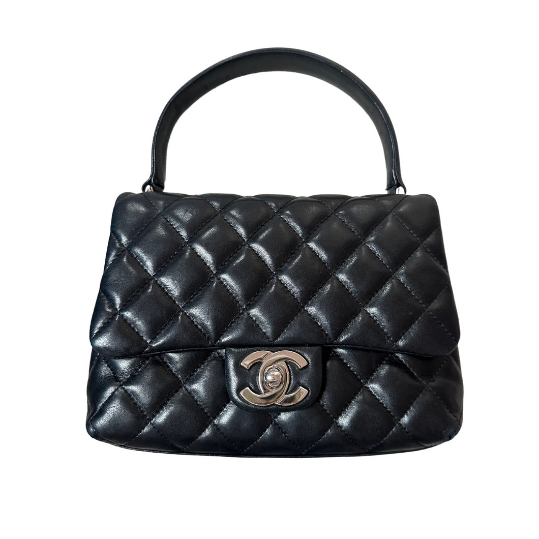 Chanel Mini Kelly in black lambskin leather with silver hardware