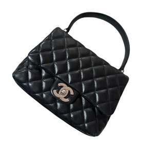 Chanel Mini Kelly in black lambskin leather with silver hardware