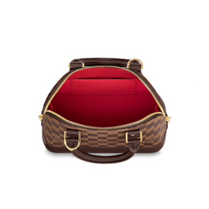 Alma BB by Louis Vuitton Available to Rent in Ireland. Interior of the bag is red